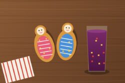 Guaguas de pan ecuatorianas decoradas con glaseado y un vaso de colada morada