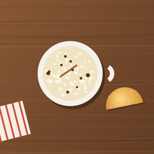 Taza de morocho ecuatoriano con canela y una empanada de viento